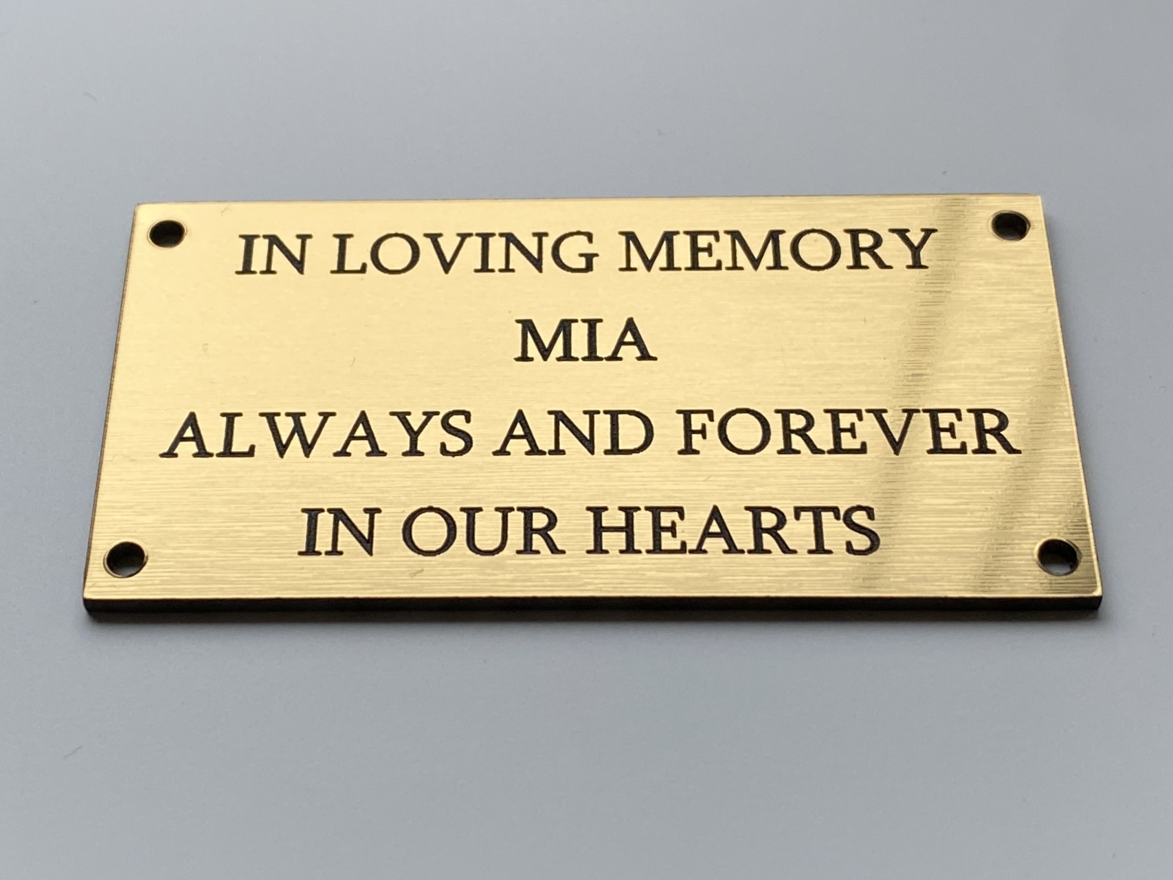Gold memorial plaque engraved In Loving Memory with four fixing holes